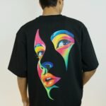 Vibrant Pop Art Face Graphic Oversized T-Shirt Black Back Design