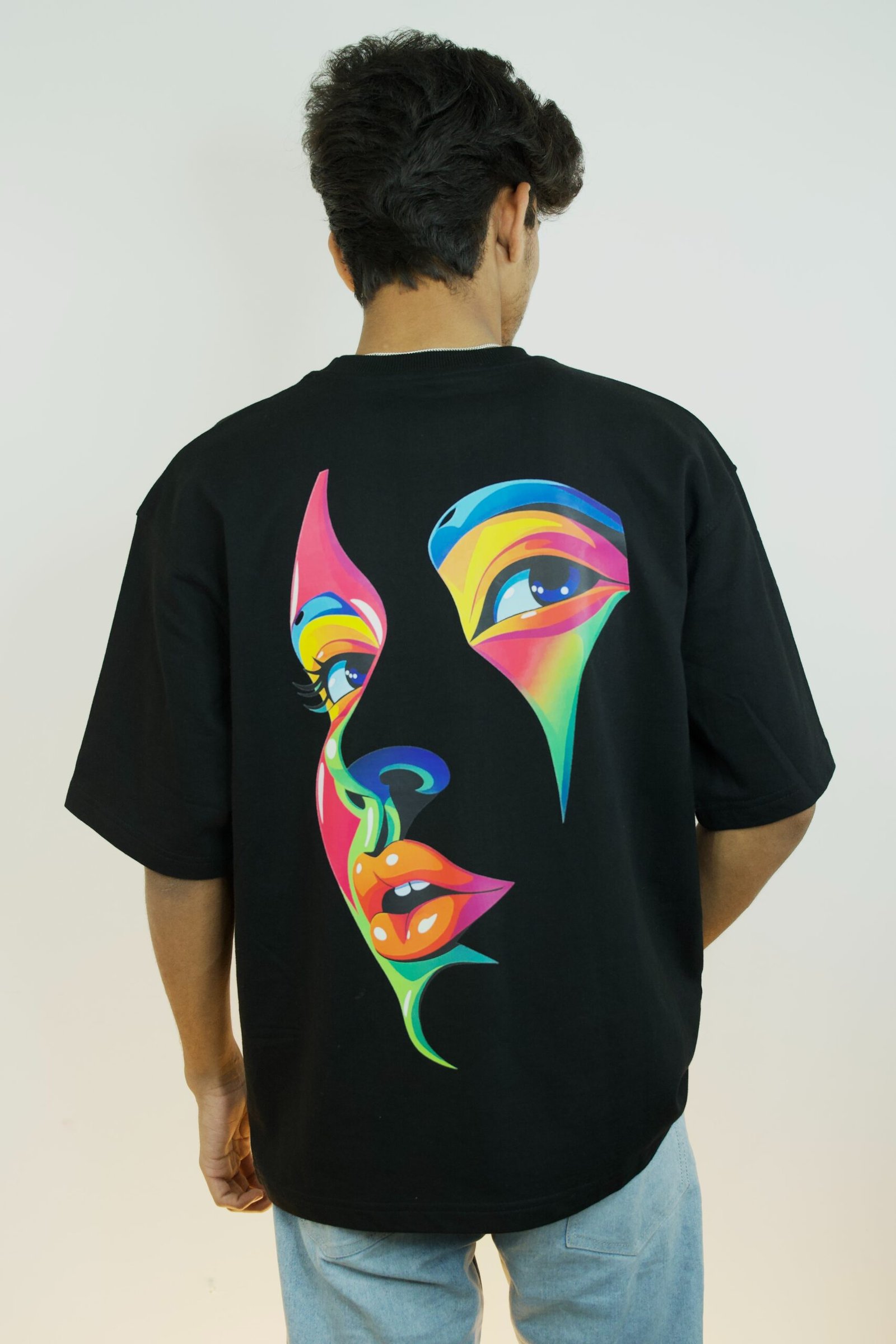 Vibrant Pop Art Face Graphic Oversized T-Shirt Black Back Design